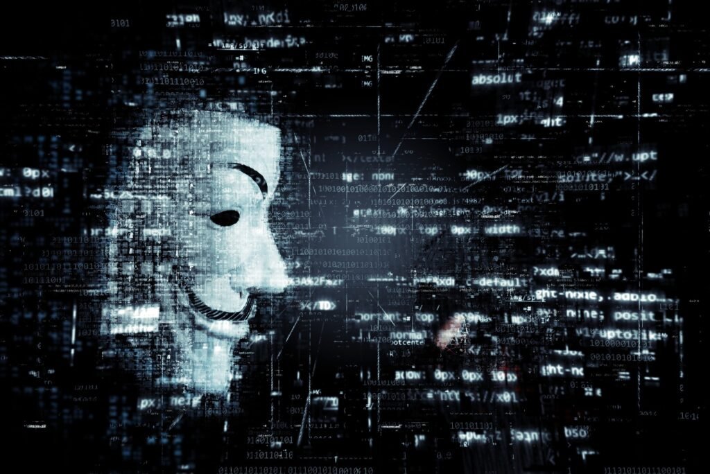Hacker mask (Guy Fawkes) amid blue digital code and matrices, symbolizing cybersecurity and hacking theme.